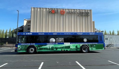The Proudly Serving Huber Heights bus in front of the Rose Music Center at the Heights. 